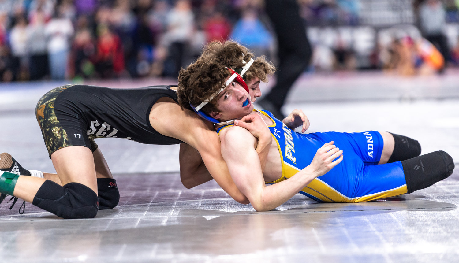 Adna’s Cameron Thomas, 113 pounds, competes against Selkirk’s Jaxson Chantry in the quarterfinals at Mat Classic XXXIV on Friday, February 17, 2023, at the Tacoma Dome. (Joshua Hart/For The Chronicle)